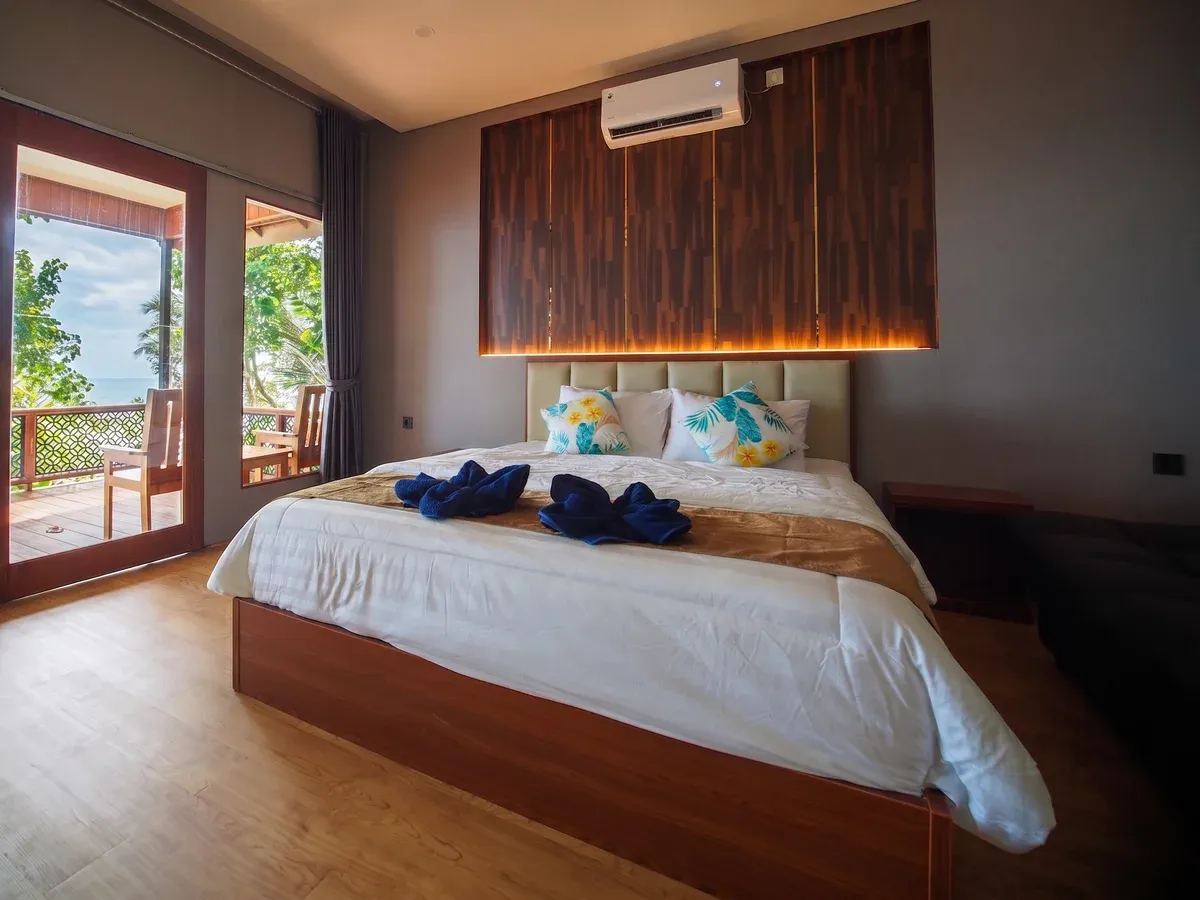 Double bedroom inside a seaview chalet, elevated above the sea.